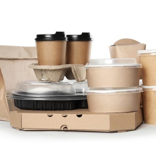 Kraft paper takeaway bag, cups, bowls, and pizza box on white